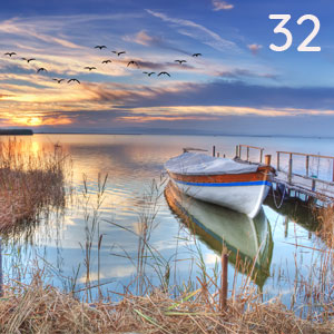 Motiv: Ruderboot bei Sonnenaufgang